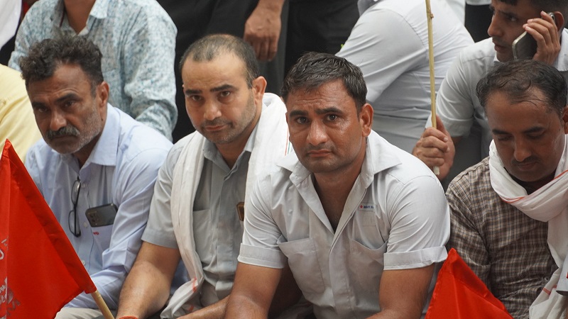 https://www.workersunity.com/wp-content/uploads/2024/07/terminated-maruti-workers-staged-protest-at-gurugram-1.jpg